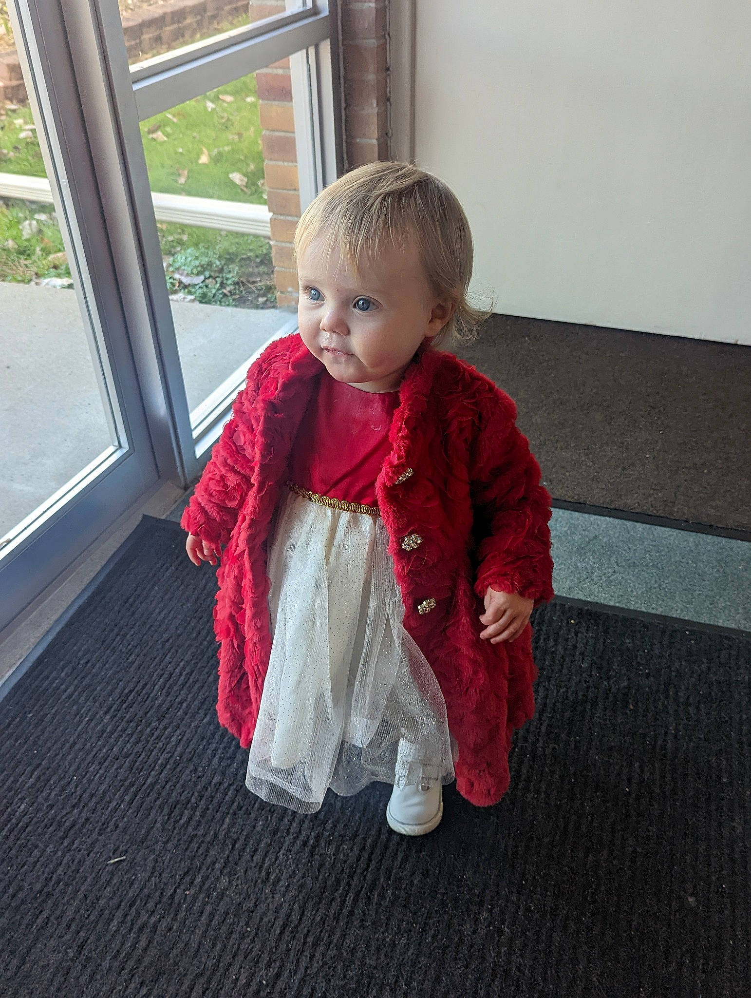 Melody joined the competition — help win amazing prizes! baby, baby_toddler_clothing, cheek, child, floor, flooring, fun, fur, grass, human_leg, pattern, person, room, sitting, sleeve, sock, toddler, window, wood