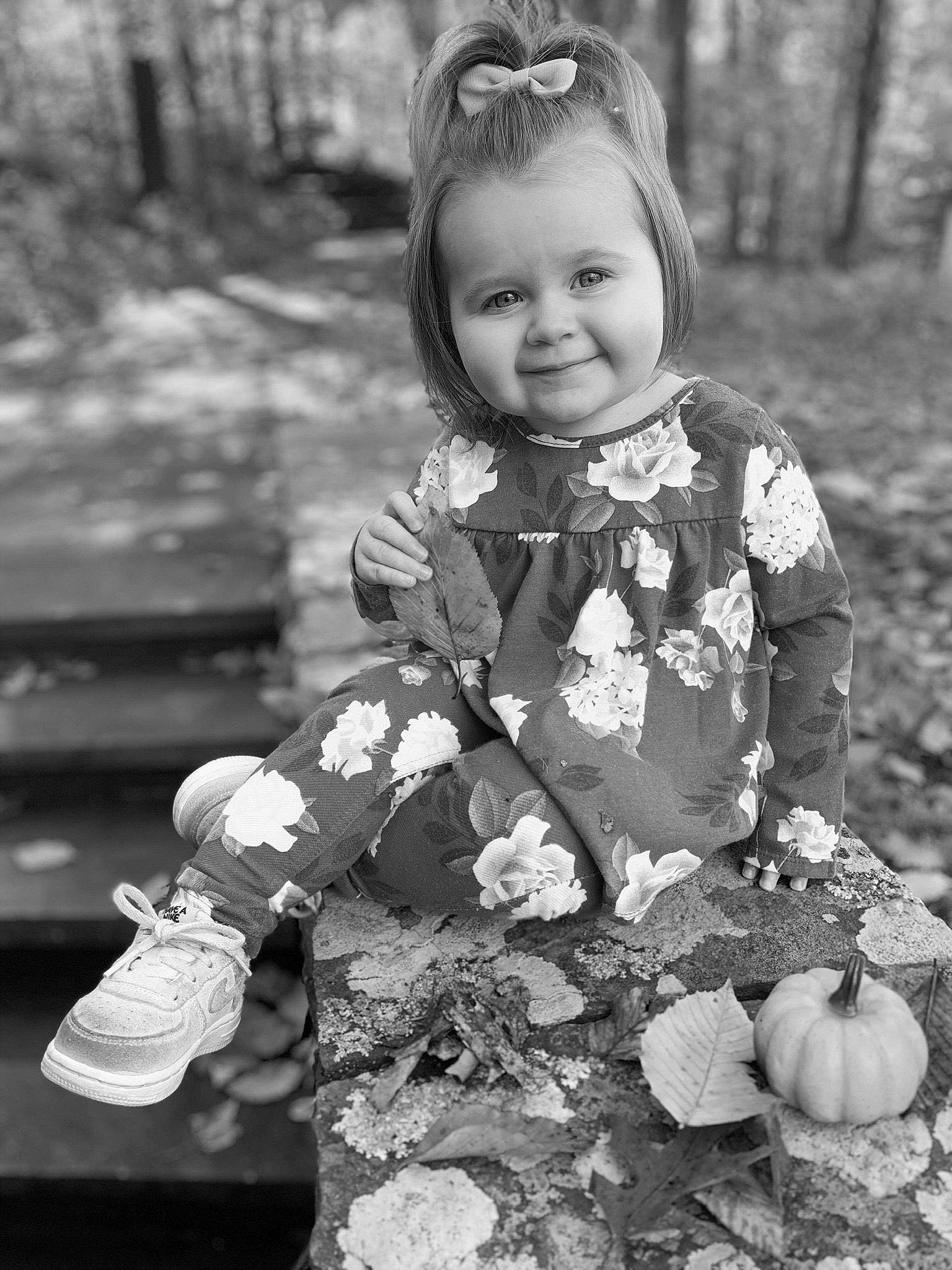 Aurora is registered to the contest to win money with this photo: black_and_white, child, joy, leaf, monochrome, monochrome_photography, person, photograph, photography, plant, play, smile, style, toddler