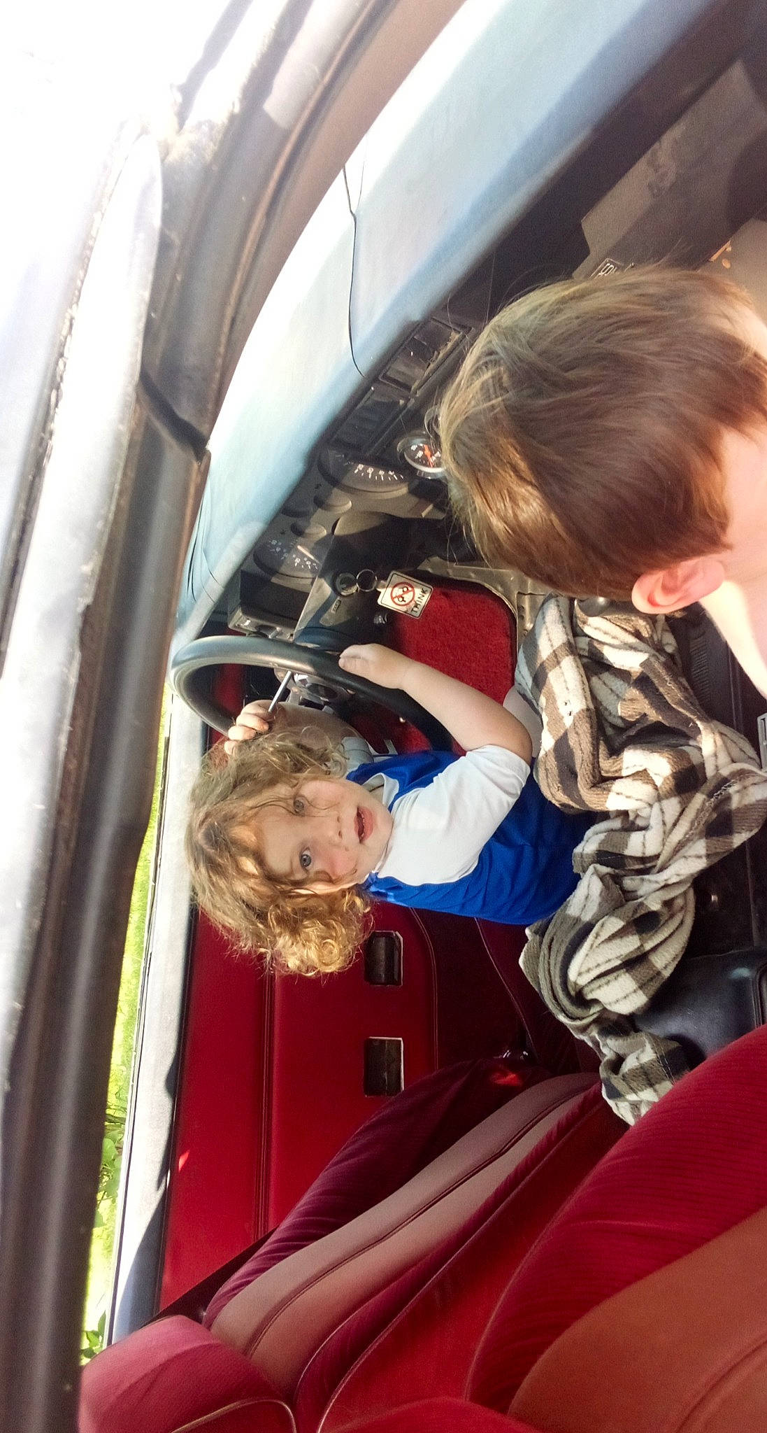 Rohan is registered to the contest to win money with this photo: auto_part, automotive_design, automotive_exterior, automotive_lighting, automotive_window_part, blond, child, dress, electric_blue, family_car, fun, glass, luxury_vehicle, motor_vehicle, person, toddler, tree, vehicle, vehicle_door, window