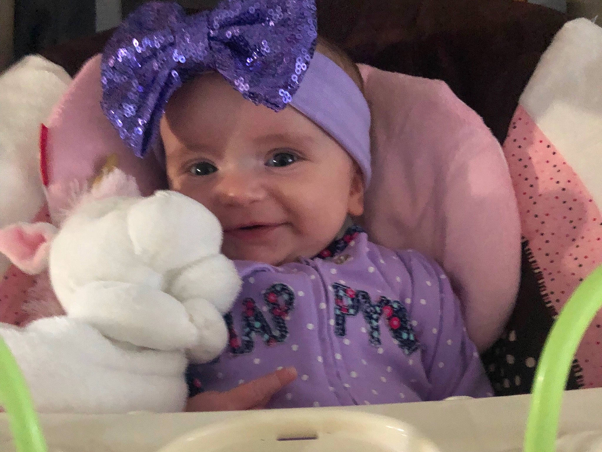 Mia Rose is registered to the contest to win money with this photo: baby, baby_products, bonnet, cheek, child, eye, face, hair_accessory, head, headgear, headpiece, iris, person, pink, product, purple, skin, smile, toddler, violet