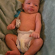 Samuel joined the competition — help win amazing prizes! baby, infant, diaper, blanket, soft, cute, newborn, skin, relaxed, lying_down, indoors, comfort, small, young_child, face, expression, sleepwear, child, person, resting