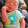 newborn, baby, sleeping, infant, onesie, pacifier, giraffe, cute, hand, person, indoor, resting, cozy, clothing, child, peaceful, portrait, human, skin, holding