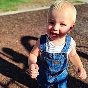 Lincoln joined the competition — help win amazing prizes! toddler, child, smiling, blonde_hair, blue_eyes, denim_overalls, striped_shirt, outdoor, sunny, playground, walking, happy, cute, person, feet, shadow, daylight, casual_clothing, young_child, portrait
