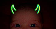 Amara joined the competition — help win amazing prizes! baby, face, child, neon_filter, devil_horns, dark_background, portrait, cute, expression, clothing, infant, indoor, closeup, head, eyes, mouth, red_clothing, glowing, digital_filter, baby_girl