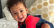 Wave joined the competition — help win amazing prizes! baby, bed, child, cozy, crawling, curly_hair, cute, denim_overalls, face, foot, furniture, hand, happy, indoors, person, pillow, red_shirt, skin, smiling, toddler