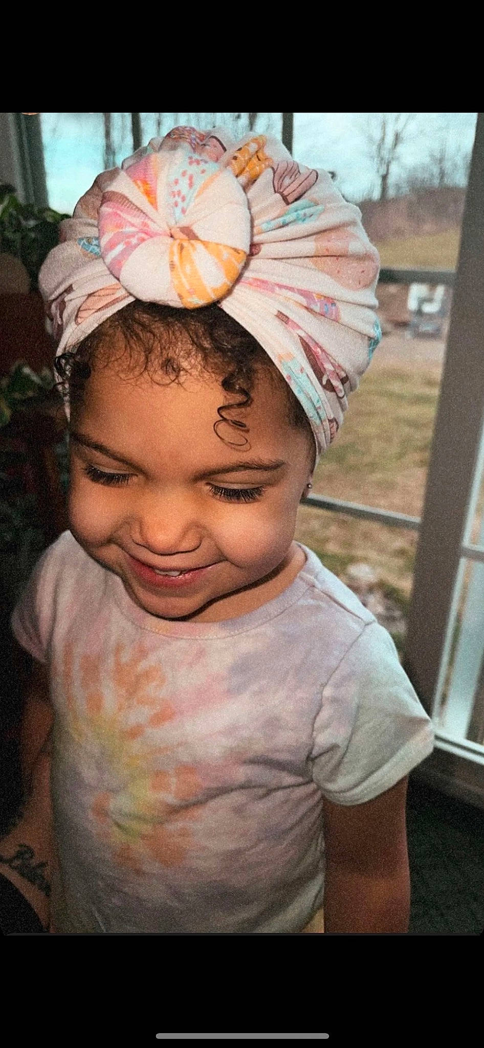 Iris is registered to the contest to win money with this photo: cap, cheek, child, chin, dress, eye, fashion_accessory, forehead, fun, happy, head, headgear, headpiece, joy, mouth, neck, person, pink, plant, skin