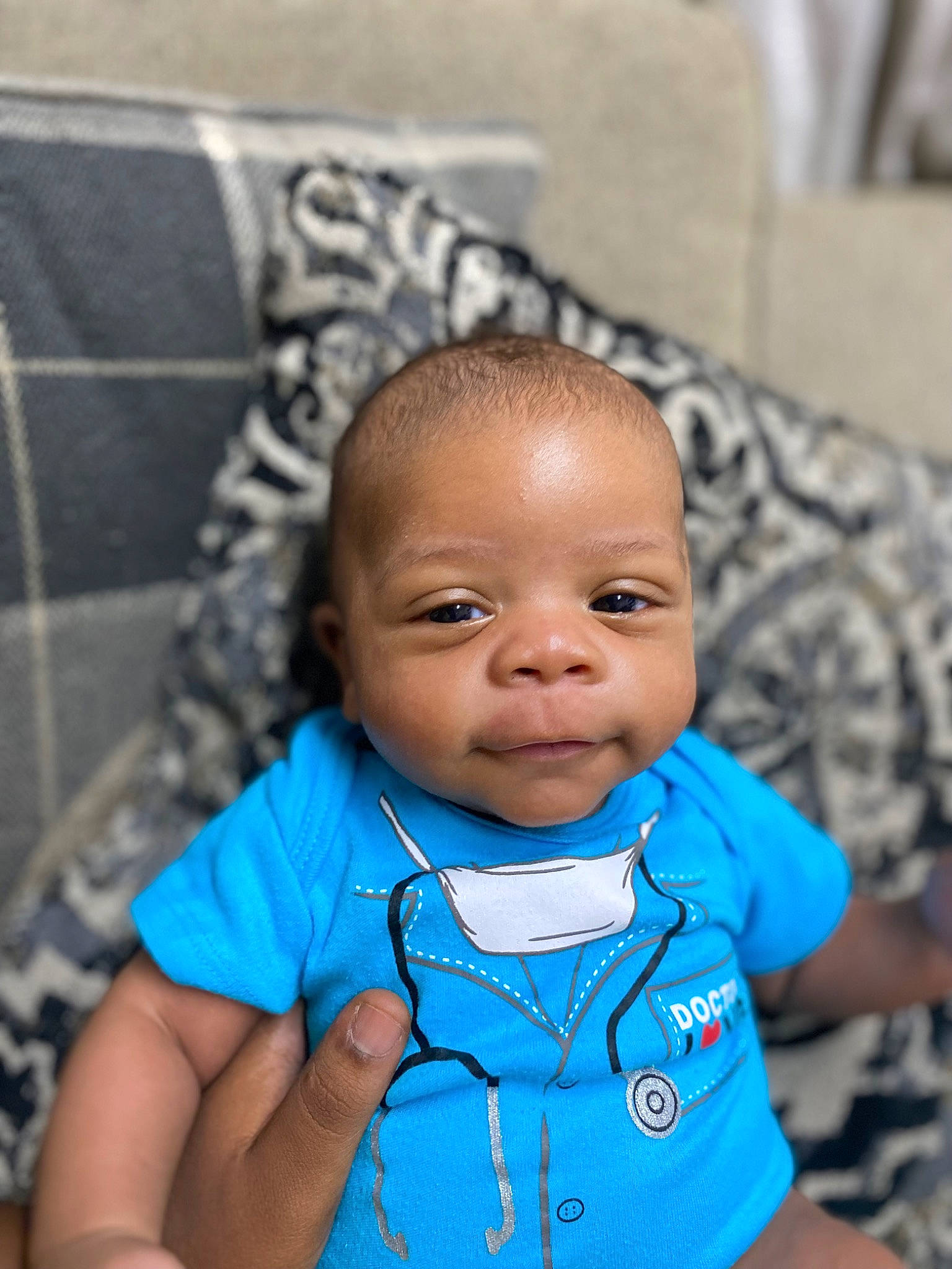 Tymen is registered to the contest to win money with this photo: azure, baby, baby_toddler_clothing, blue, cheek, chin, cool, eye, face, forehead, hairstyle, happy, head, iris, lip, mouth, nose, person, skin, sleeve