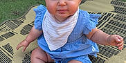 Holly joined the competition — help win amazing prizes! baby, child, sitting, outdoor, grass, mat, blue_dress, bib, cute, curly_hair, chubby_cheeks, smiling, person, infant, summer, playtime, barefoot, happy, portrait, nature