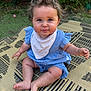 baby, child, sitting, outdoor, grass, mat, blue_dress, bib, cute, curly_hair, chubby_cheeks, smiling, person, infant, summer, playtime, barefoot, happy, portrait, nature