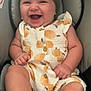 Amelia joined the competition — help win amazing prizes! baby, smiling, child, headband, green, orange_pattern, sitting, seat, cushion, clothing, infant, happy, cute, portrait, chubby, skin, hand, foot, indoors, closeup