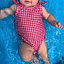 baby, child, swimming_pool, water, red_headband, red_swimsuit, floating, infant, summer, outdoor, cute, relaxed, splash, skin, legs, arms, face, head, gingham_pattern, blue_water