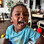 Amari joined the competition — help win amazing prizes! child, smiling, laughing, indoor, living_room, blue_shirt, furniture, happy, person, toddler, candid, home, table, chair, toy, floor, face, casual_clothing, joy, expression