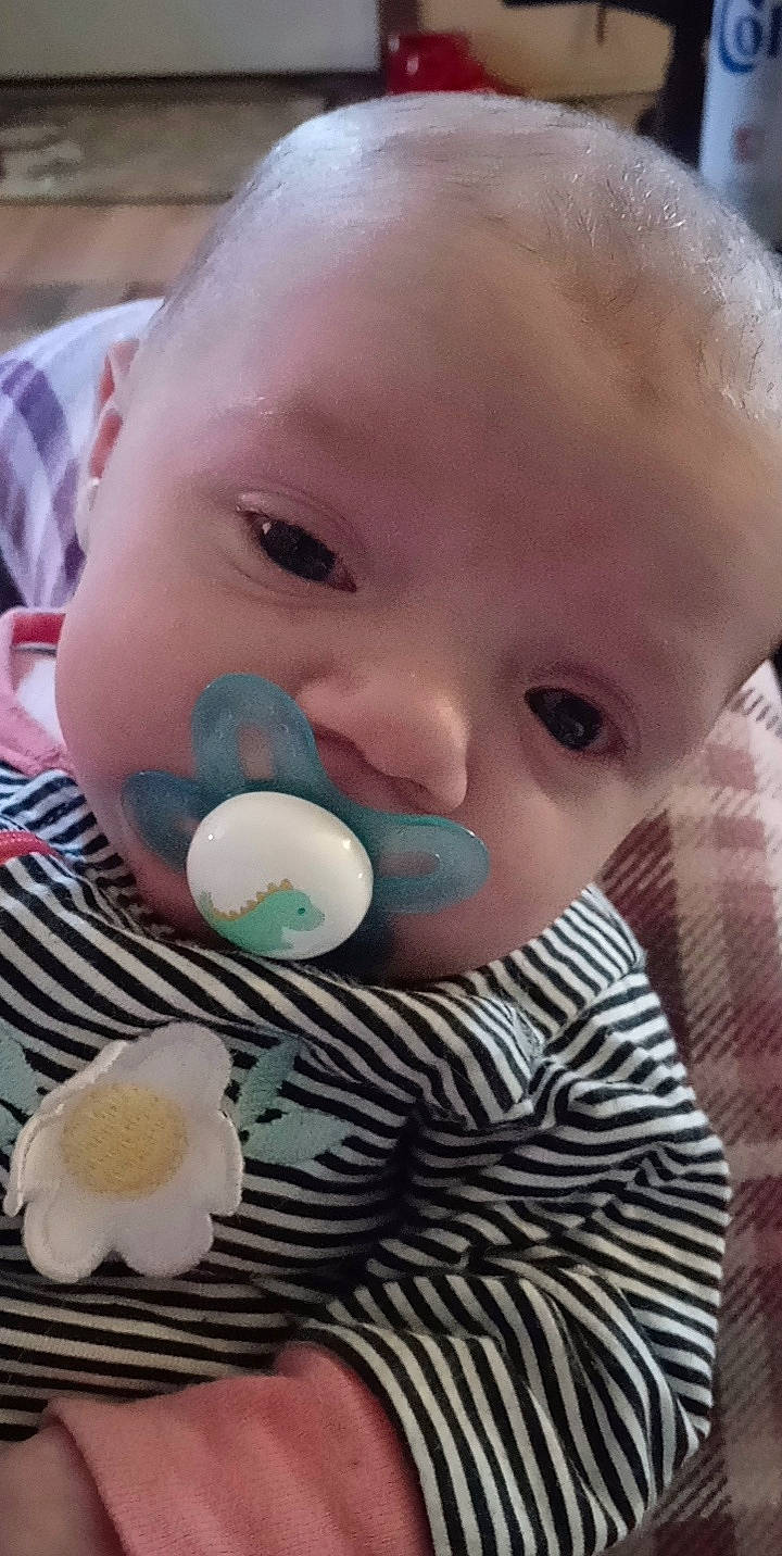 Mia is registered to the contest to win money with this photo: baby, baby_products, baby_toddler_clothing, baby_toys, cheek, child, close_up, ear, eyebrow, eyelash, fun, hairstyle, happy, iris, nose, pattern, person, skin, sweetness, toddler