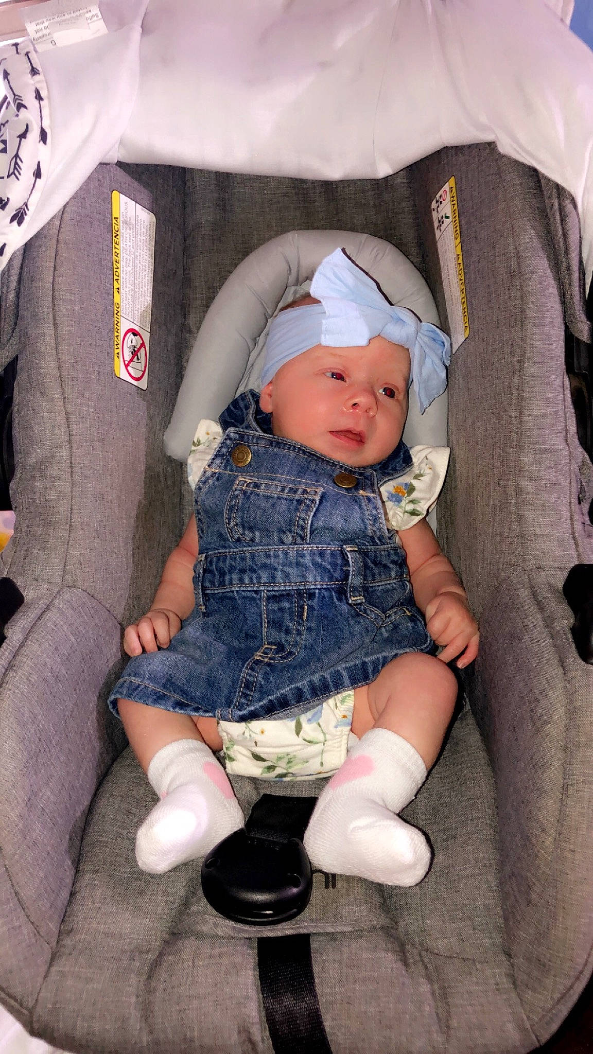 Layken joined the competition — help win amazing prizes! baby, baby_products, baby_toddler_clothing, chair, cheek, child, comfort, facial_expression, fashion_accessory, headgear, headwear, lap, pattern, person, sitting, skin, sleeve, sock, textile, thigh