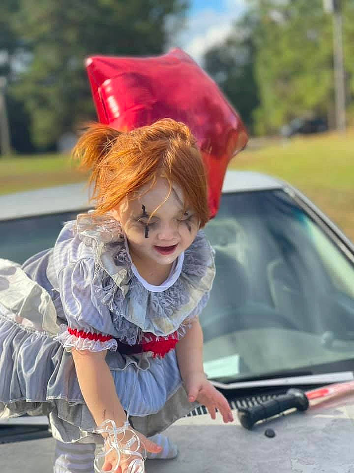 Elizabeth joined the competition — help win amazing prizes! automotive_design, automotive_exterior, automotive_lighting, bumper, car, dress, grass, happy, hood, motor_vehicle, person, personal_luxury_car, photograph, red, smile, snapshot, street_fashion, vehicle, vehicle_door, windscreen_wiper