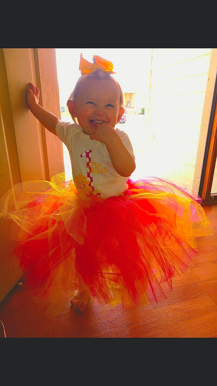 Talia joined the competition — help win amazing prizes! art, baby, baby_toddler_clothing, ballet_tutu, dress, entertainment, event, fashion_design, flooring, fun, happy, headpiece, joy, magenta, orange, peach, performing_arts, person, pink, ruffle