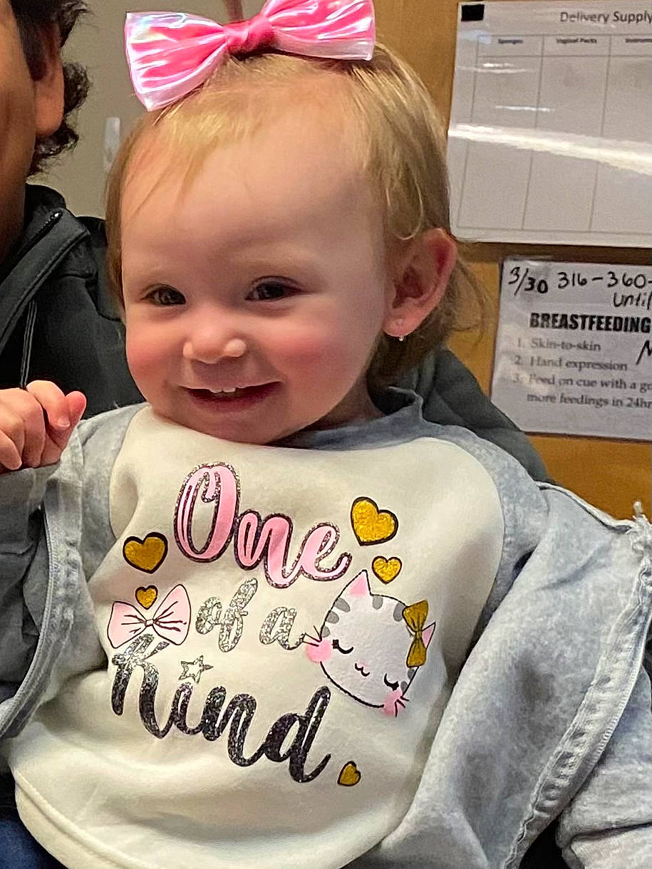 Talia joined the competition — help win amazing prizes! cheek, child, clothing, face, facial_expression, fun, gesture, hair, hairstyle, happy, head, human_body, joy, organ, party_hat, person, pink, shipping_box, sleeve, smile