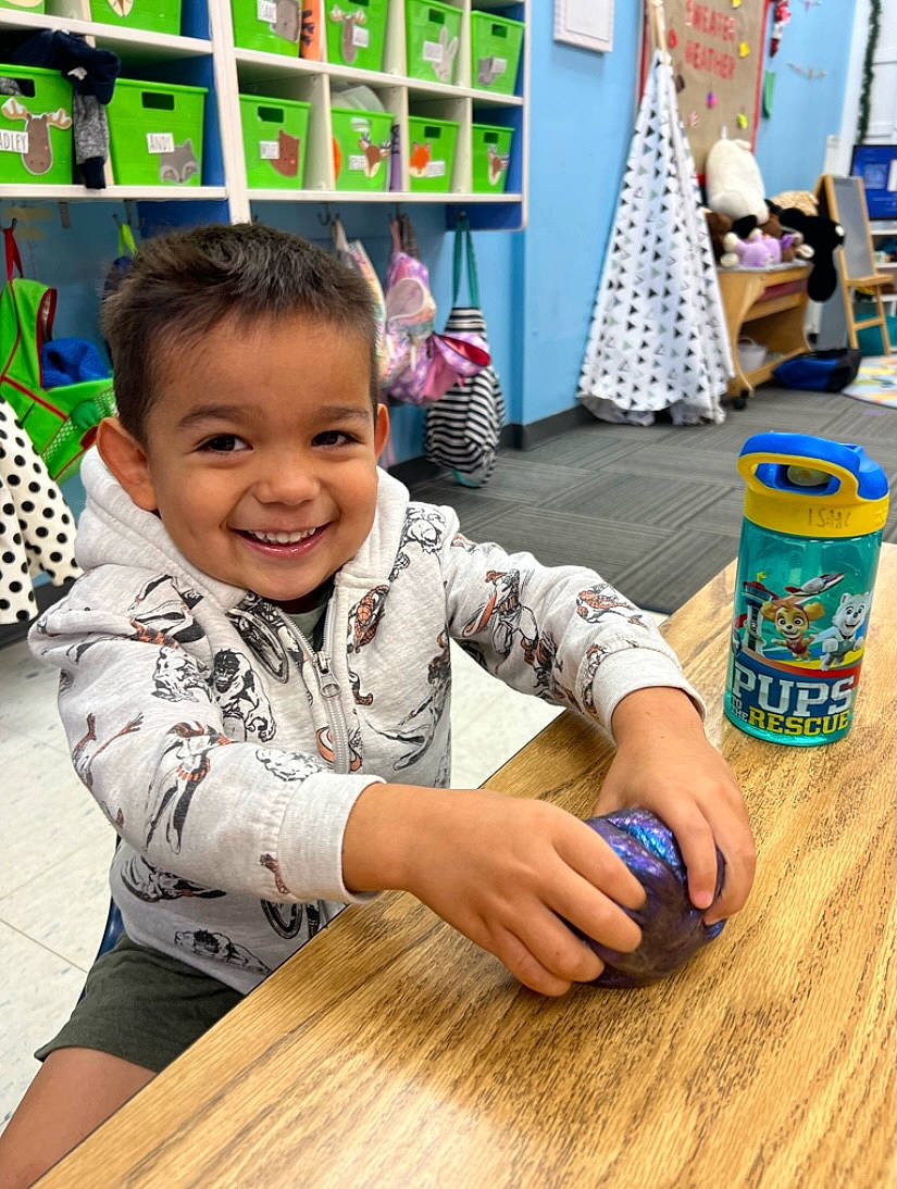 Isaac joined the competition — help win amazing prizes! baby_toddler_clothing, chair, child, flooring, fun, green, happy, hardwood, joy, leisure, person, play, recreation, smile, snapshot, summer, t_shirt, table, toddler, varnish