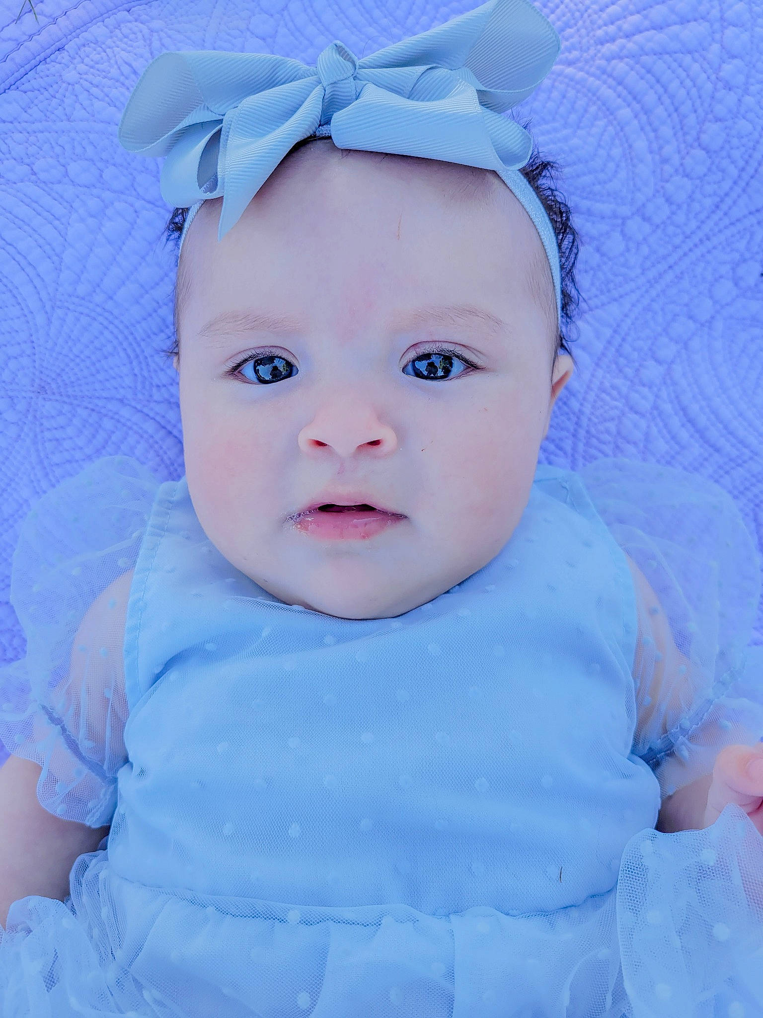 Dahlia is registered to the contest to win money with this photo: azure, baby, baby_toddler_clothing, beauty, blue, cheek, child, electric_blue, eyelash, flash_photography, happy, hat, lip, pattern, person, pink, purple, skin, sleeve, toddler