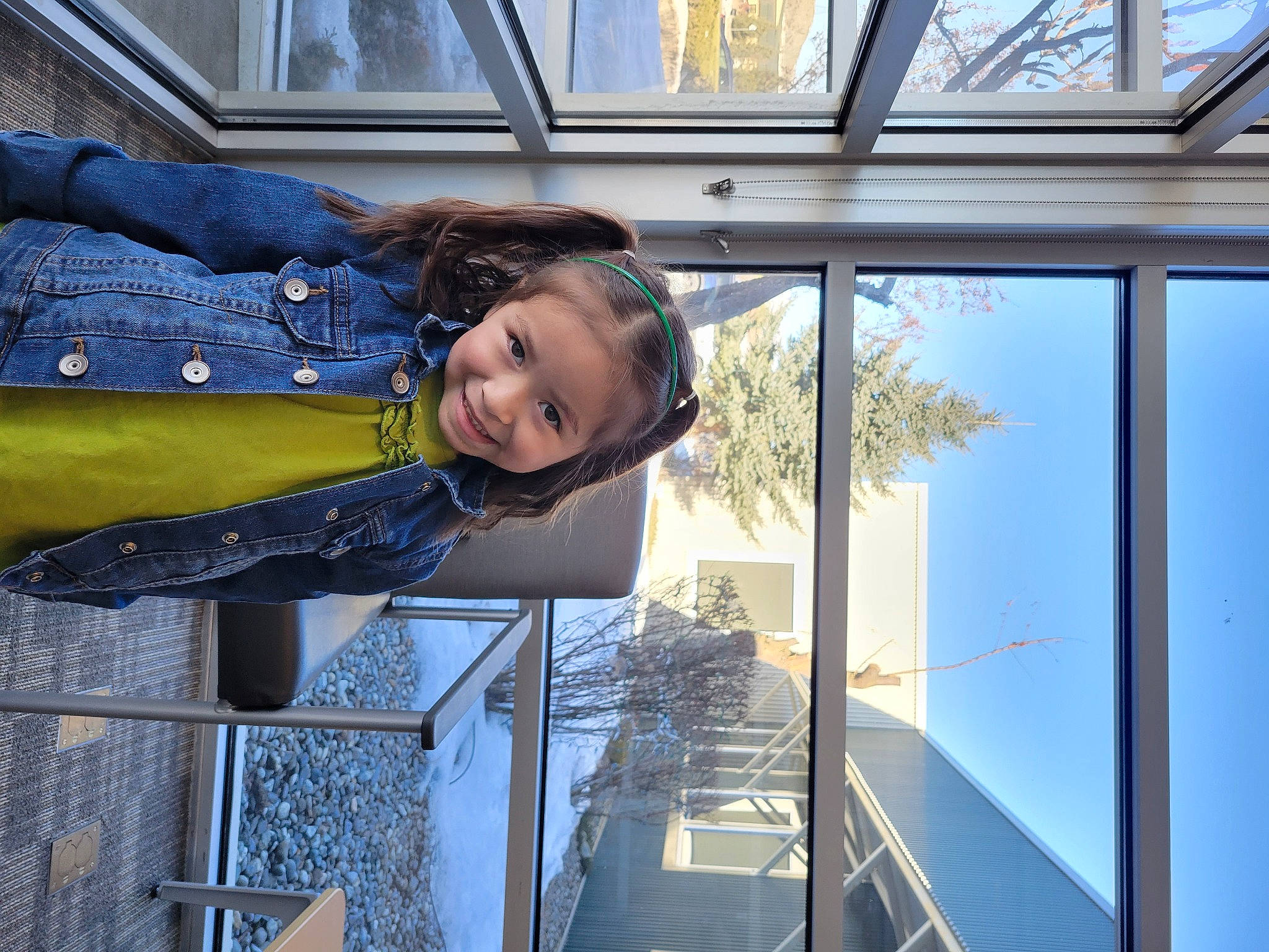 Juniper is registered to the contest to win money with this photo: child, daylighting, daytime, electric_blue, facade, fun, glass, happy, house, joy, leisure, person, reflection, sky, smile, transparent_material, travel, tree, vacation, window
