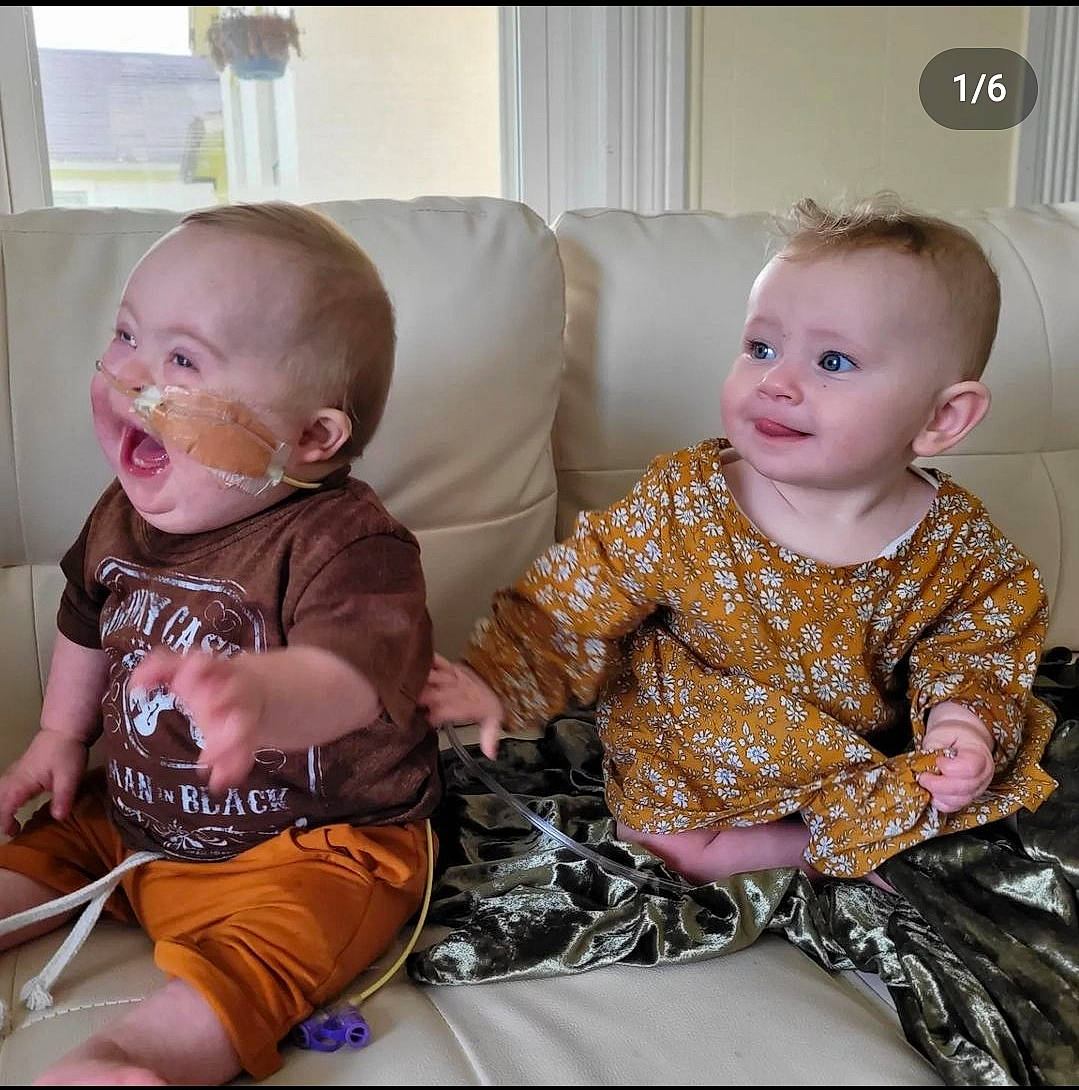 Josephine is registered to the contest to win money with this photo: baby, baby_toddler_clothing, chair, cheek, clothing, comfort, couch, eye, face, fun, hairstyle, head, human_body, iris, lap, person, sharing, skin, sleeve, t_shirt