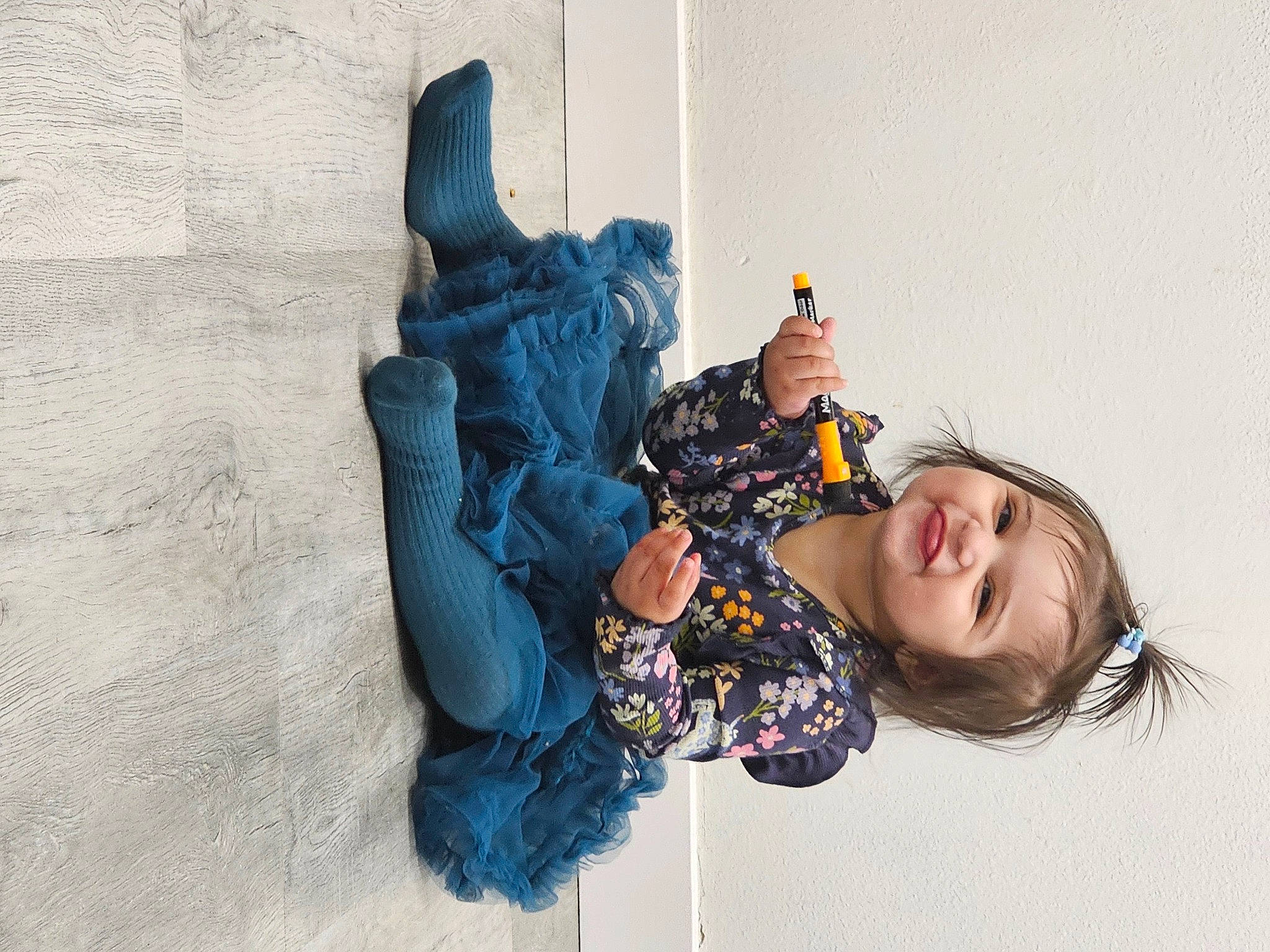 Mahnoor is registered to the contest to win money with this photo: baby, child, comfort, denim, electric_blue, fashion_accessory, fun, fur, happy, human_leg, joy, pattern, person, sitting, smile, thigh, toddler, tree, winter