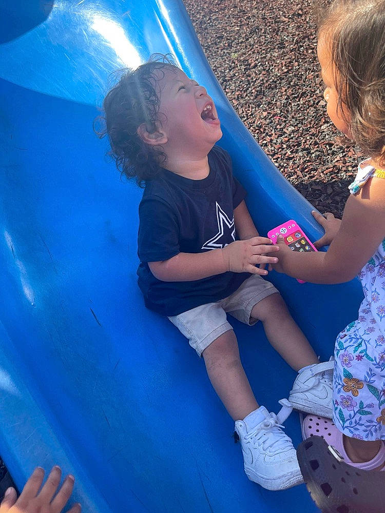 Jose joined the competition — help win amazing prizes! aqua, azure, blue, child, electric_blue, finger, fun, grass, hand, happy, human_leg, leg, leisure, outdoor_play_equipment, person, play, recreation, sandal, t_shirt, toddler