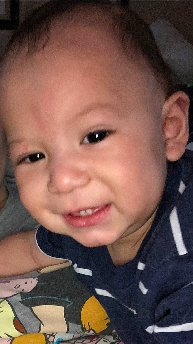 Jose is registered to the contest to win money with this photo: baby, baby_toddler_clothing, cheek, chin, ear, eyebrow, eyelash, finger, forehead, gesture, happy, iris, lip, mammal, mouth, nose, person, skin, sleeve, smile