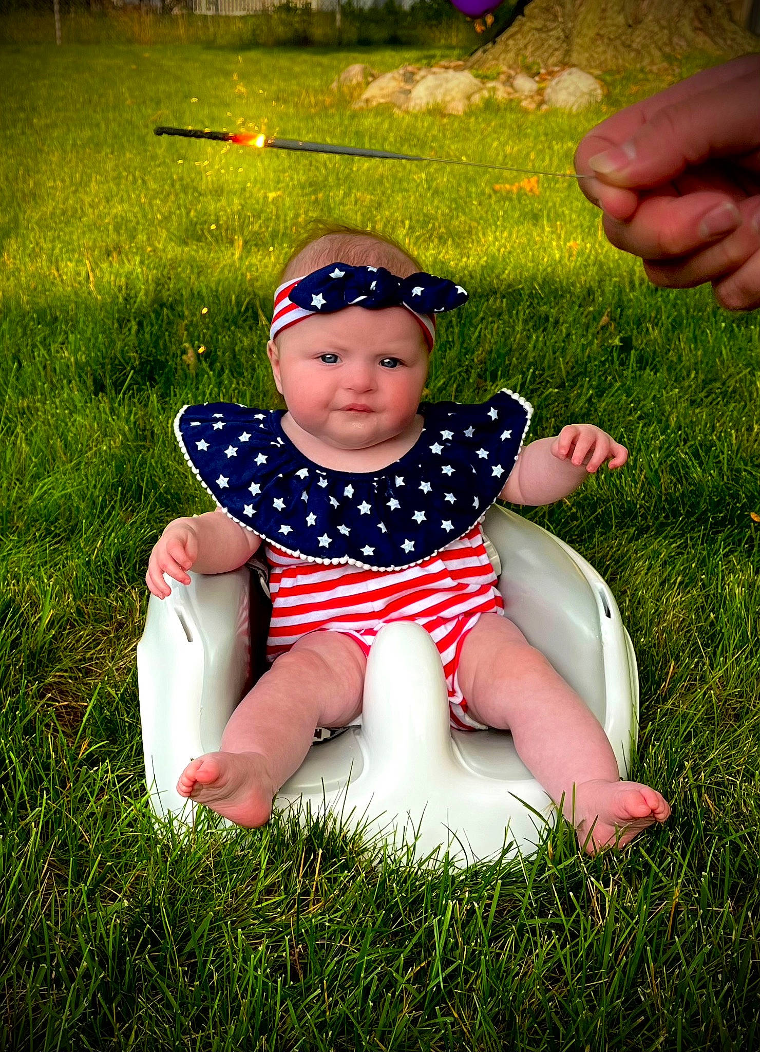 Salem is registered to the contest to win money with this photo: baby, baby_toddler_clothing, child, eyewear, fun, goggles, grass, grassland, happy, headwear, human_leg, lawn, leisure, meadow, people_in_nature, person, plant, recreation, sitting, sunlight