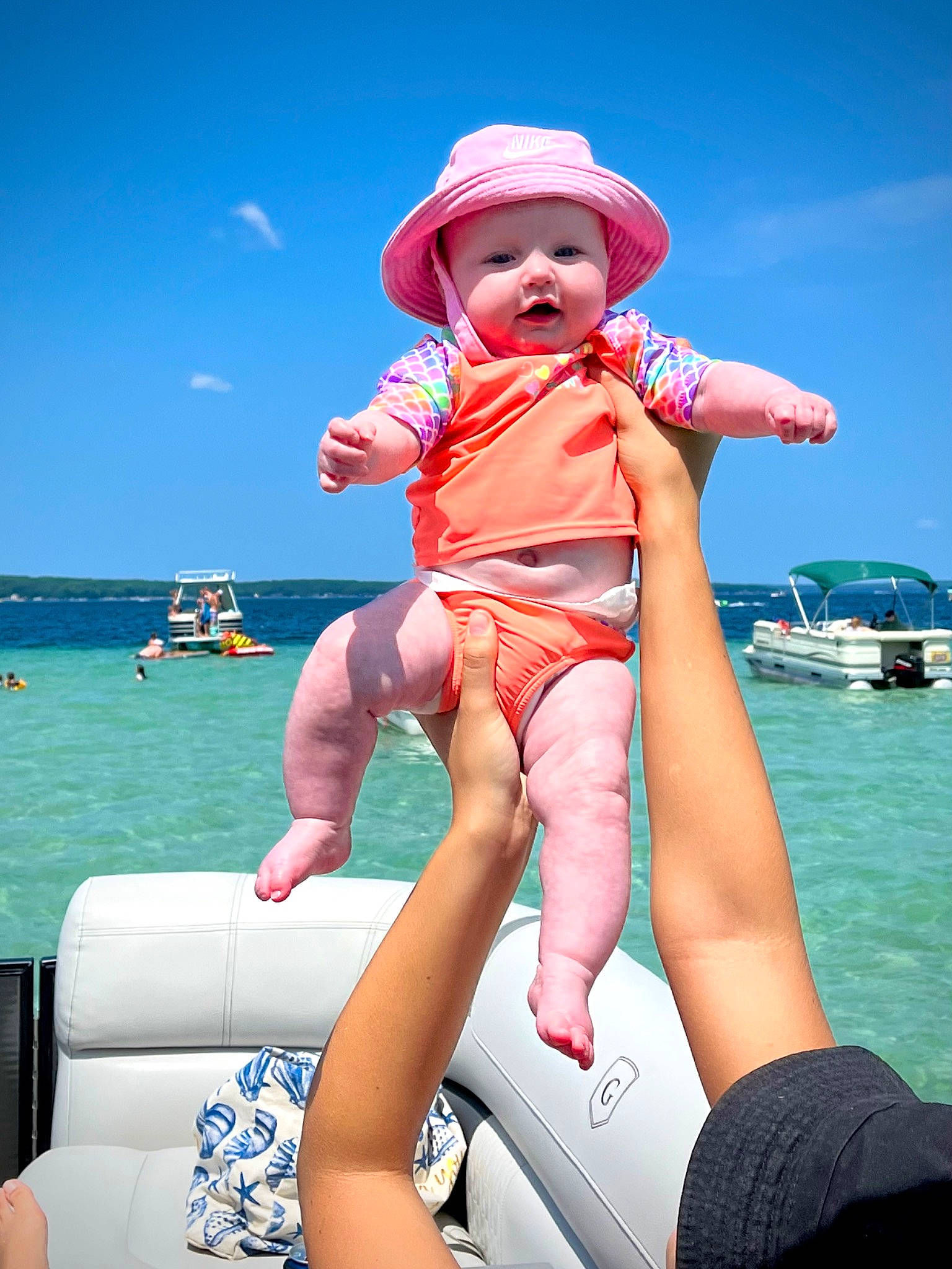 Salem joined the competition — help win amazing prizes! baby_toddler_clothing, blue, boat, boats_and_boating_equipment_and_supplies, comfort, fun, happy, hat, headwear, human_leg, leisure, muscle, person, recreation, sky, sun_hat, thigh, toddler, travel, water