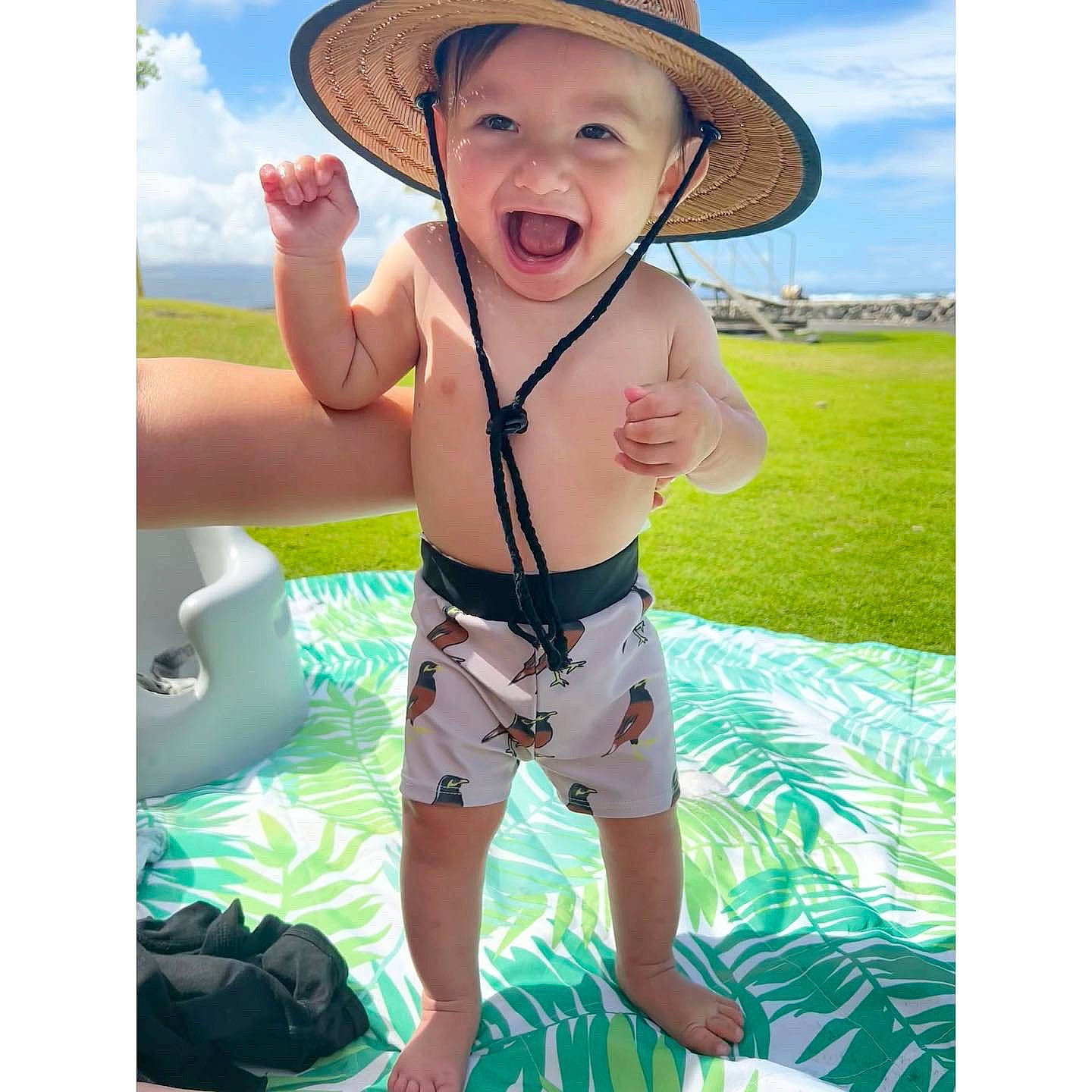Slater joined the competition — help win amazing prizes! baby, cowboy_hat, grass, green, happy, hat, headwear, leisure, luggage_and_bags, people_in_nature, person, recreation, shorts, sky, sleeve, sun_hat, swimwear, thigh, toddler, trunk