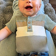 Stetson joined the competition — help win amazing prizes! baby, child, smiling, happy, jeans, shirt, clothing, person, indoor, carpet, rug, furniture, blanket, legs, denim, cute, infant, portrait, face, expression