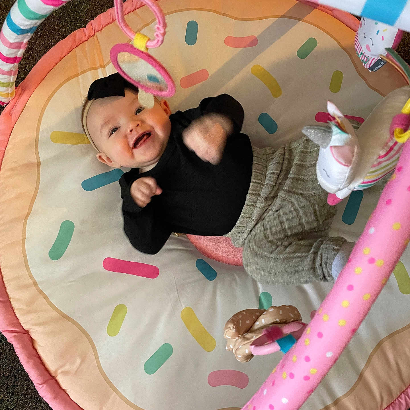 Cambree is registered to the contest to win money with this photo: baby, bed, blanket, clothing, couch, cradle, crib, face, furniture, happy, hat, head, indoors, infantbed, laughing, person, photography, playarea, portrait, toy