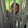 Hollyann is registered to the contest to win money with this photo: toddler, child, curly_hair, blinds, window, greenery, daisy_pattern, pajamas, playful, indoor, daylight, face, hands, vertical_blinds, smile, cute, home, person, nature, casual