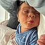 baby, infant, sleeping, puckered_lips, blue_onesie, blanket, soft_fabric, closeup, face, newborn, cute, peaceful, cozy, child, skin, hand, indoors, portrait, resting, toddler