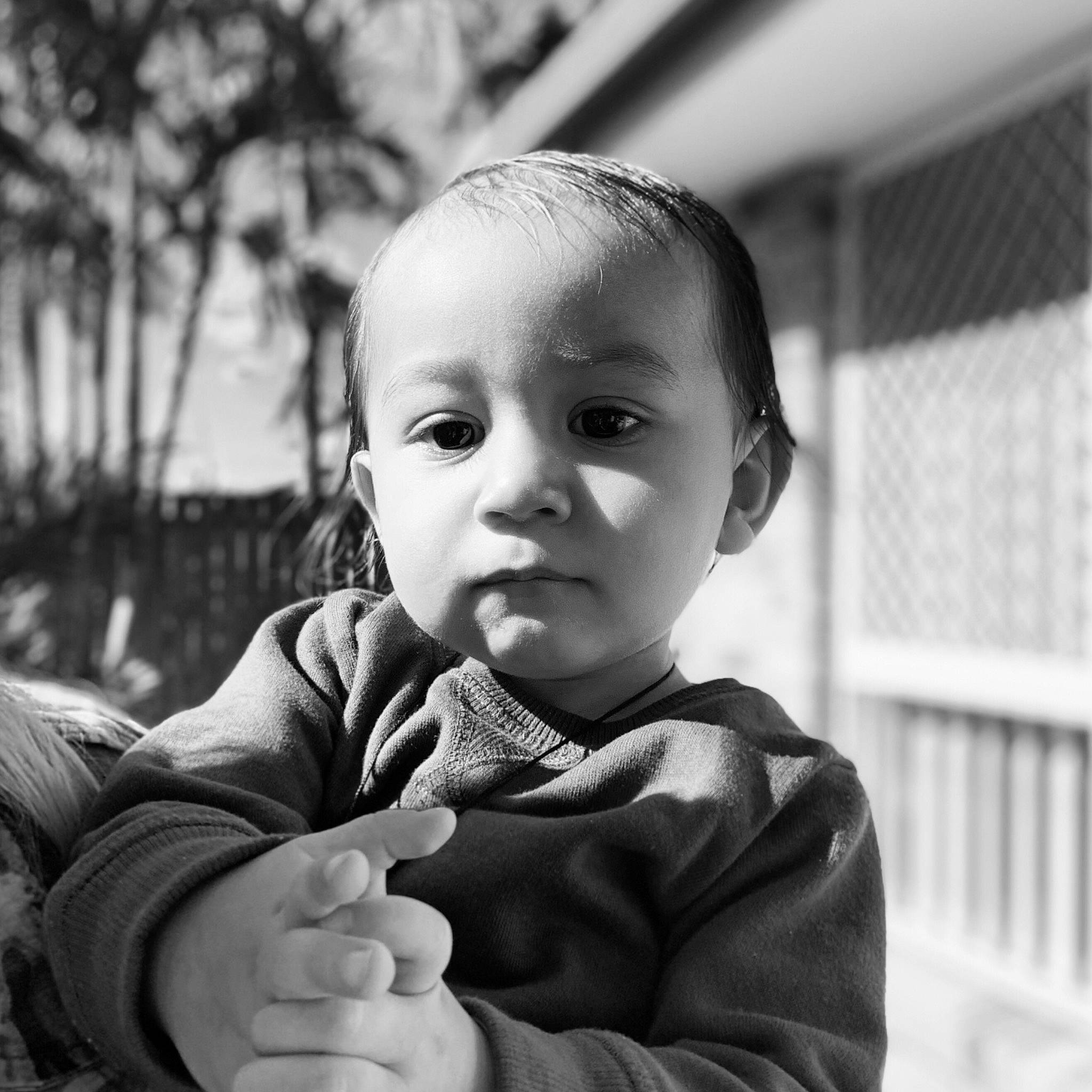 Lamar is registered to the contest to win money with this photo: baby, black, black_and_white, cheek, child, eye, face, finger, gesture, hand, monochrome, monochrome_photography, nose, person, photograph, photography, smile, stock_photography, style, thumb