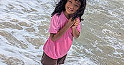 Kimberlee Montero joined the competition — help win amazing prizes! child, smiling, beach, ocean, seawater, waves, surf, foam, shoreline, outdoors, summer, pink_shirt, shorts, curly_hair, wet_hair, standing, portrait, happy, sunlight, vacation