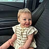 baby, child, car_seat, blue_eyes, smile, striped_clothing, knitwear, food, fries, seatbelt, car_interior, window, door, cute, happy, messy, sitting, person, infant, portrait