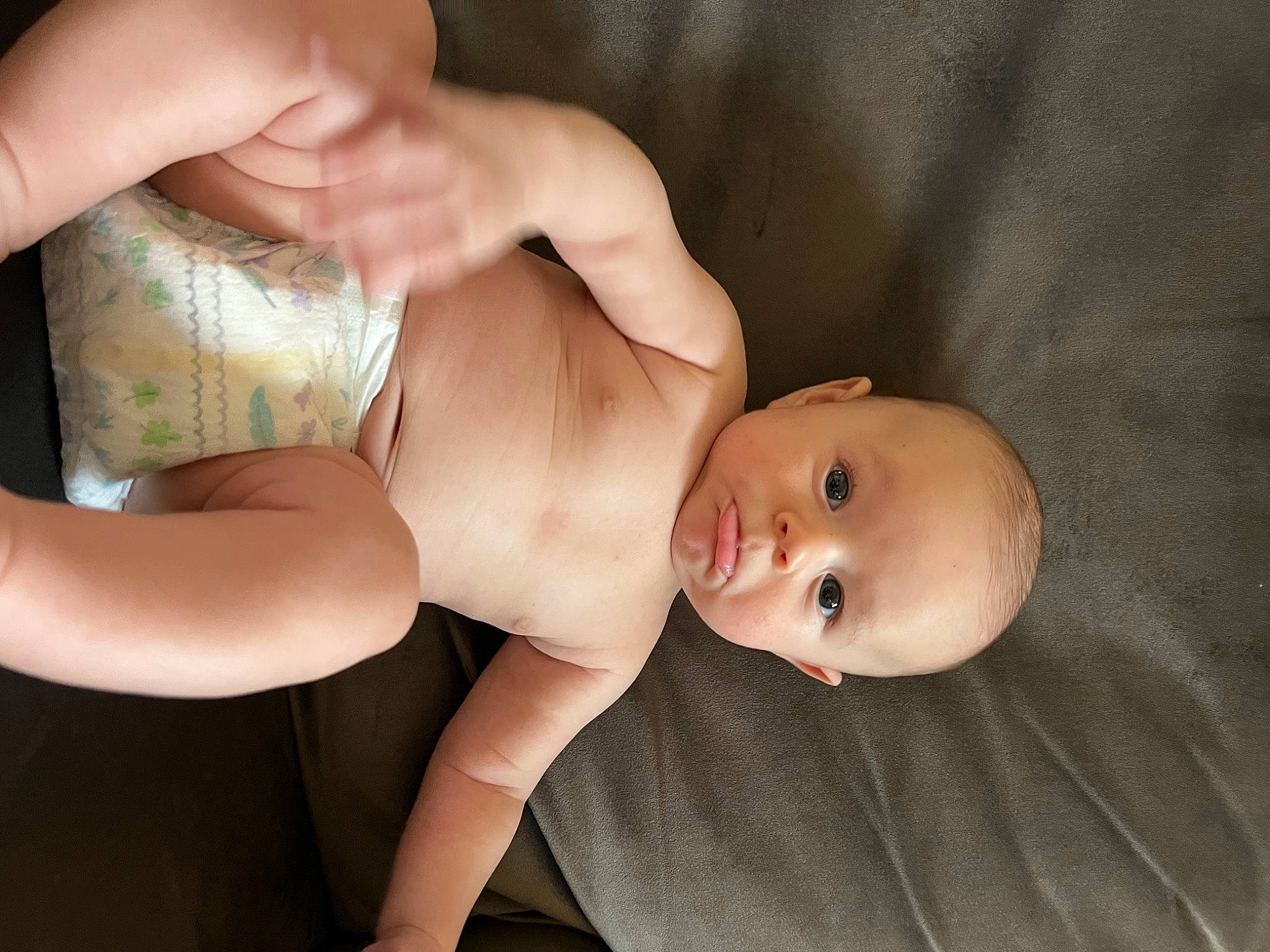 Julian is registered to the contest to win money with this photo: abdomen, baby, cheek, chest, comfort, eye, facial_expression, finger, flash_photography, gesture, hand, human_body, joint, leg, neck, person, skin, stomach, thigh, toddler