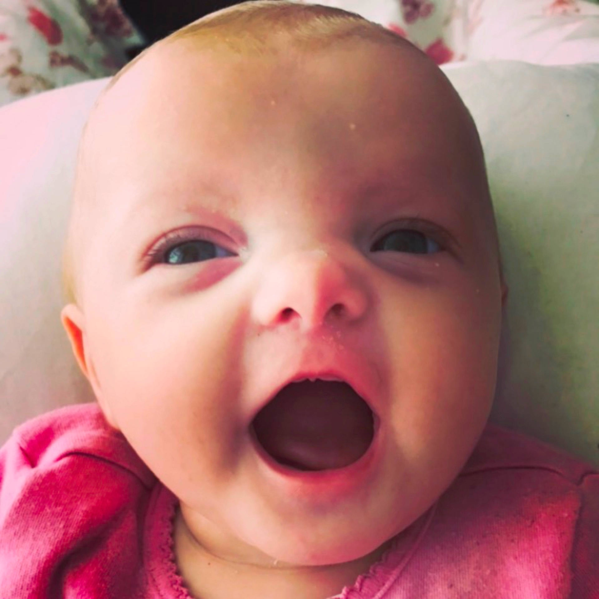 Avaya-skye is registered to the contest to win money with this photo: cheek, child, close_up, eye, face, facial_expression, girl, head, infant, lip, mouth, nose, organ, person, pink, skin, smile, toddler, tongue, tooth