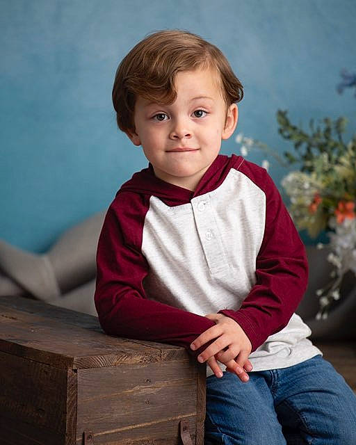 Karsen is registered to the contest to win money with this photo: cheek, child, child_model, outerwear, people, person, photography, portrait, portrait_photography, sitting, sleeve, smile, standing, t_shirt, toddler