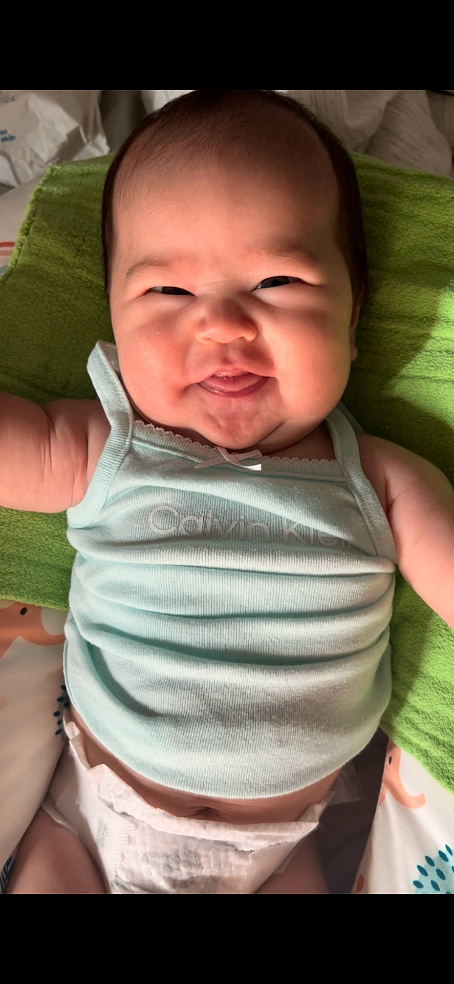 Davanee is registered to the contest to win money with this photo: baby, bodypart, clothing, cushion, diaper, face, finger, frown, hand, happy, head, homedecor, mouth, newborn, person, photography, portrait, sleeping, smile, t_shirt