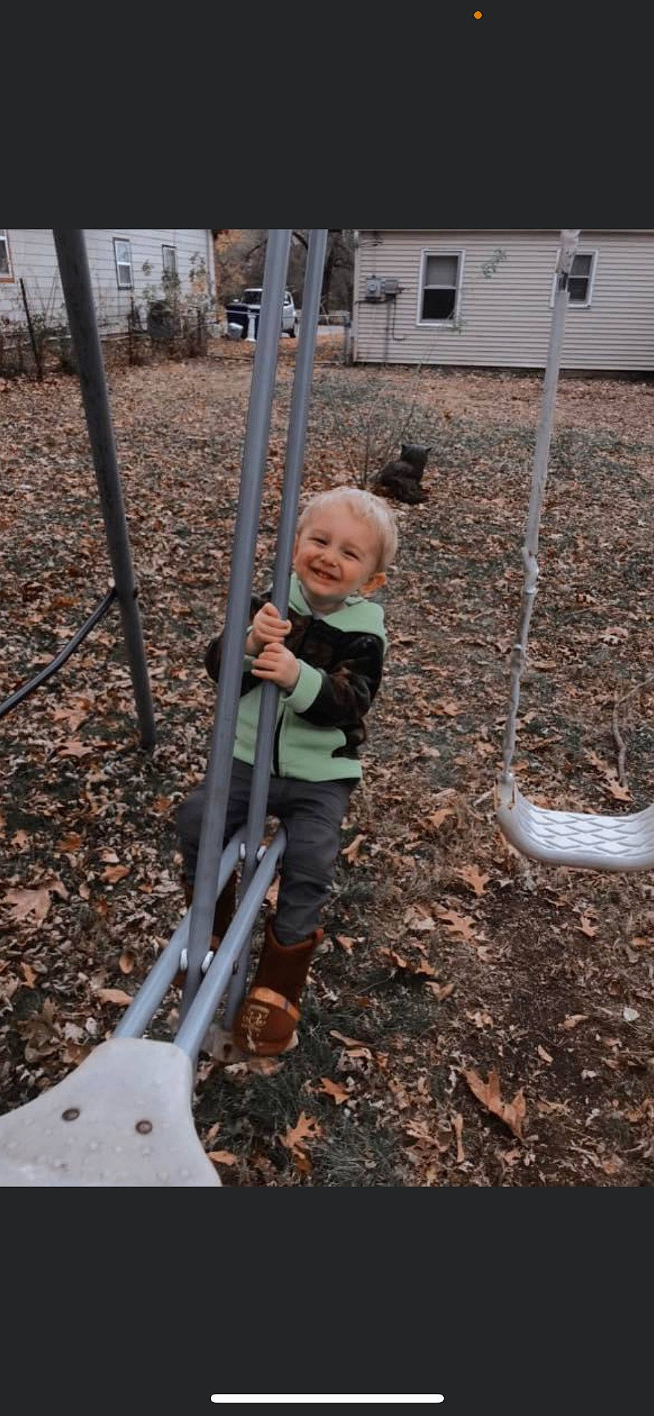 Broc is registered to the contest to win money with this photo: baby, baby_toddler_clothing, child, city, fun, grass, joy, leisure, outdoor_play_equipment, person, plant, play, playground, recreation, soil, swing, toddler, tree, wood