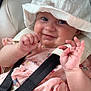 baby, child, hat, pink_dress, car_seat, smile, hands, straps, cute, infant, face, playful, seatbelt, clothing, closeup, portrait, happy, skin, headwear, sitting
