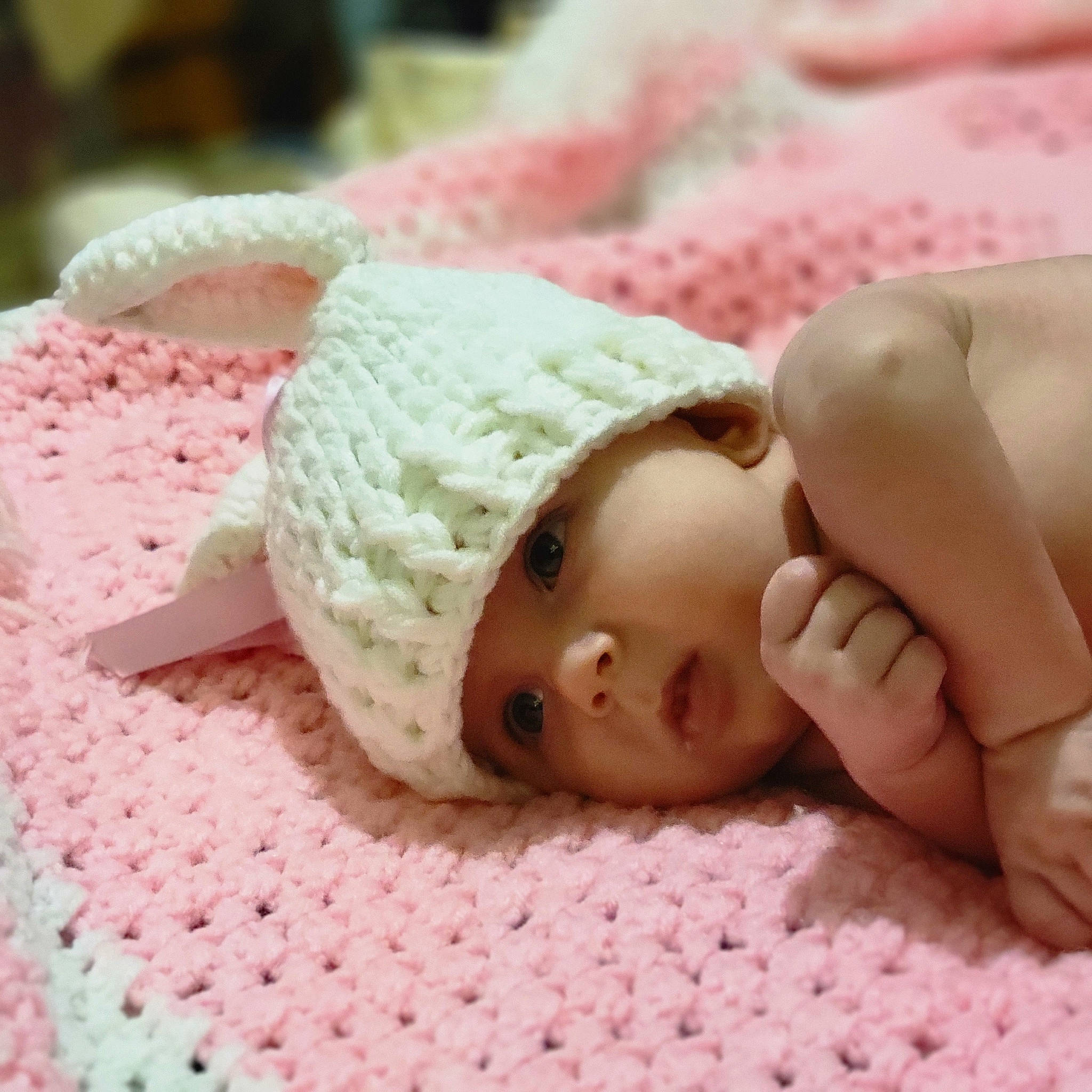 Jayde is registered to the contest to win money with this photo: cap, cheek, child, doll, eyelash, fashion_accessory, fawn, finger, hand, head, headwear, human_body, knit_cap, linens, nail, person, pink, skin, thumb, toy