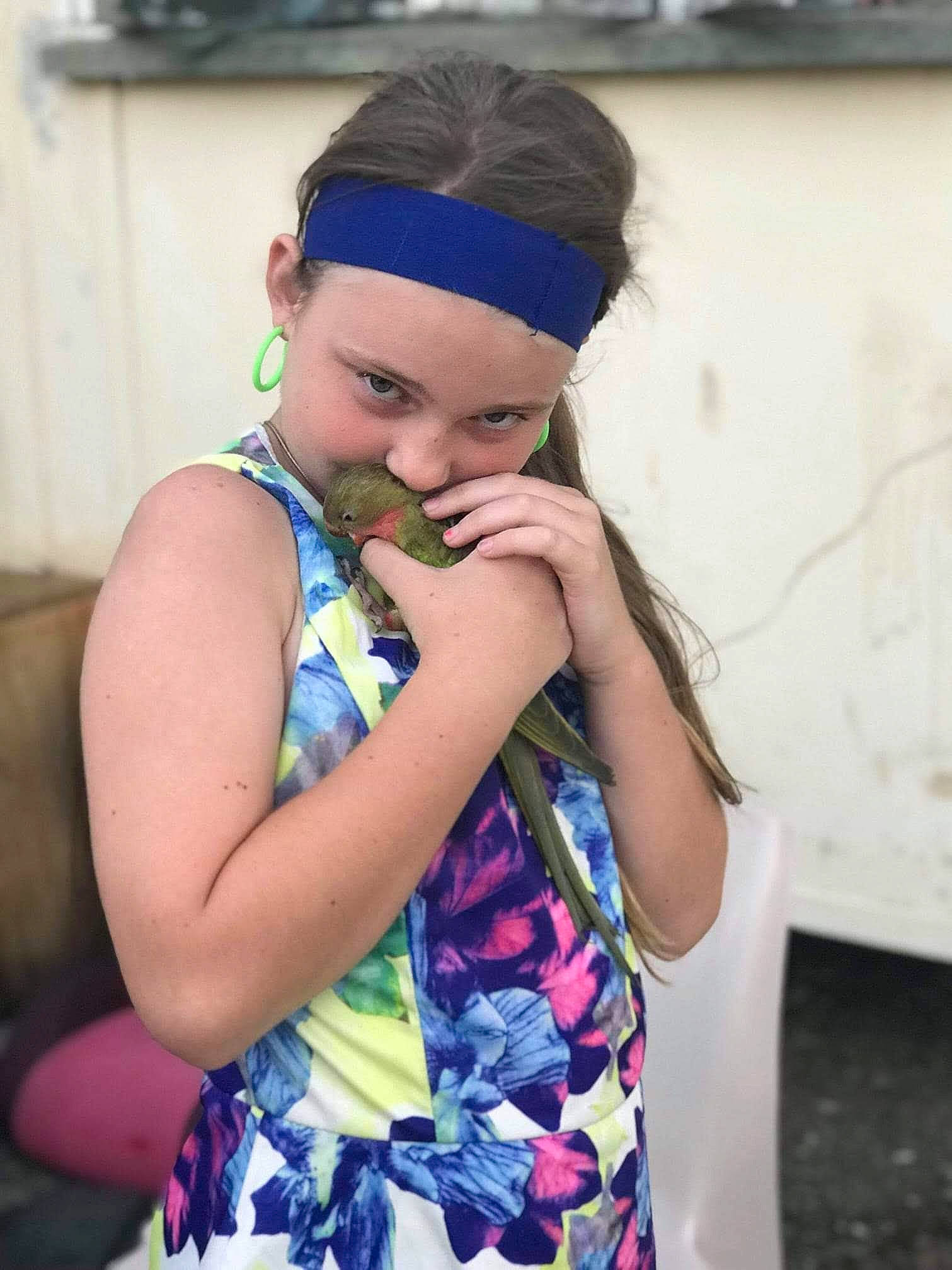 Anneliese is registered to the contest to win money with this photo: azure, blond, blue, cap, child, cool, dress, electric_blue, fashion_design, flash_photography, gesture, happy, headband, headpiece, headwear, jewellery, neck, pattern, person, shoulder