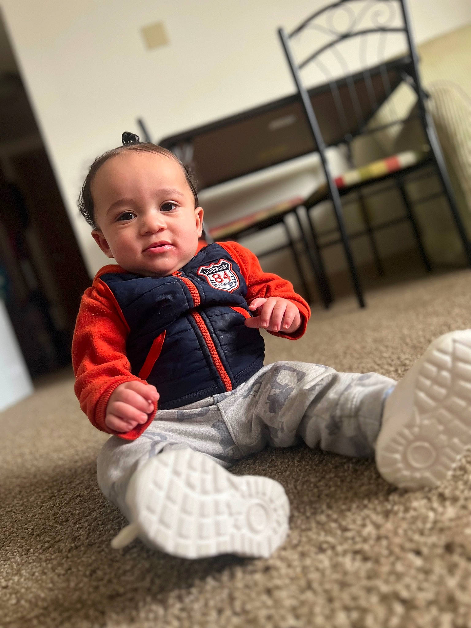 Nehemiah joined the competition — help win amazing prizes! baby, baby_toddler_clothing, chair, child, comfort, floor, flooring, fun, fur, happy, human_body, pattern, person, play, room, sitting, sleeve, smile, sock, toddler