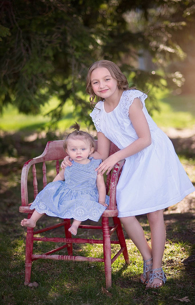 Chelsea is registered to the contest to win money with this photo: baby, chair, child, daughter, dress, family, joy, mother, people, people_in_nature, person, photograph, photography, pink, plant, sibling, sitting, skin, spring, summer