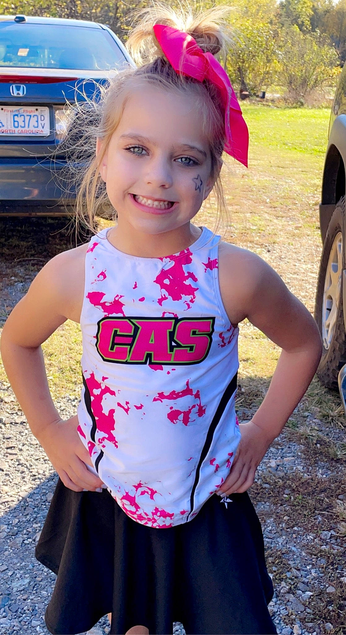 Kinsley joined the competition — help win amazing prizes! automotive_tire, baby_toddler_clothing, blue, child, cool, facial_expression, hairstyle, happy, head, joy, light, person, photograph, pink, red, sleeve, smile, tire, toddler, waist