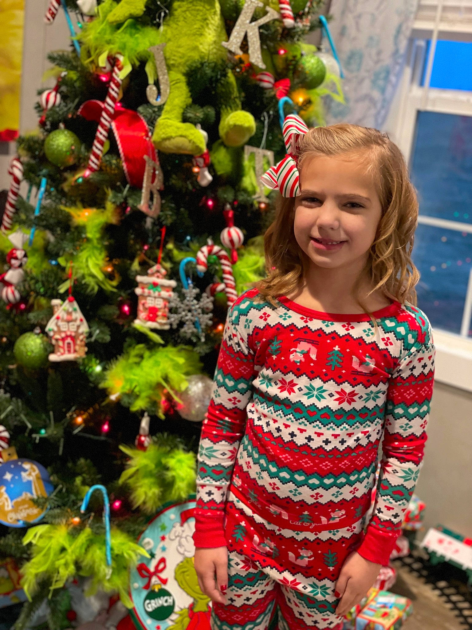 Kinsley joined the competition — help win amazing prizes! blue, christmas_decoration, christmas_ornament, christmas_tree, event, evergreen, fun, green, happy, holiday, holiday_ornament, human_body, joy, leaf, ornament, person, public_space, sleeve, smile, standing